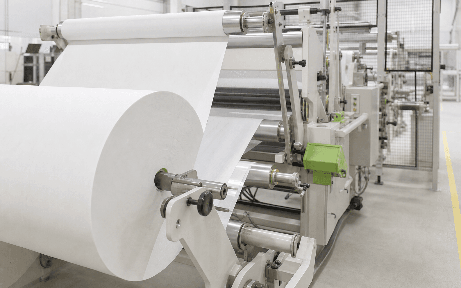 Illustrative view of tissue material moving through a converting line